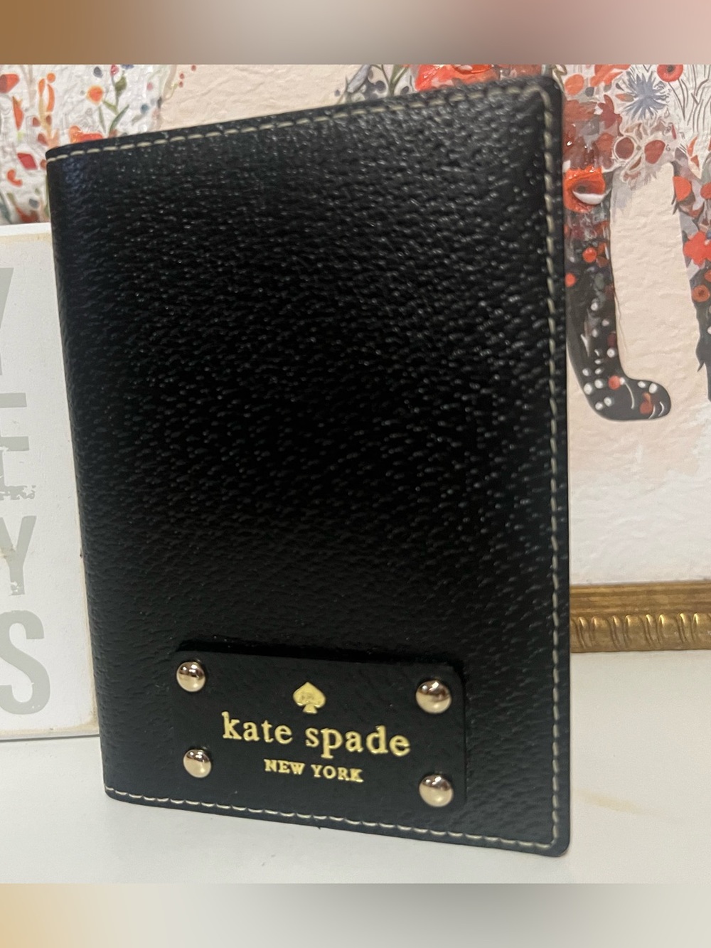 kate spade Wellesley Black Pebbled Leather Passport Cover with Gold Logo Plate
